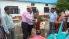rural municipality head distributing agro machinaries to local farmer 